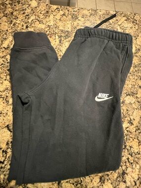 Nike women’s Black Joggers with White Swoosh Logo medium